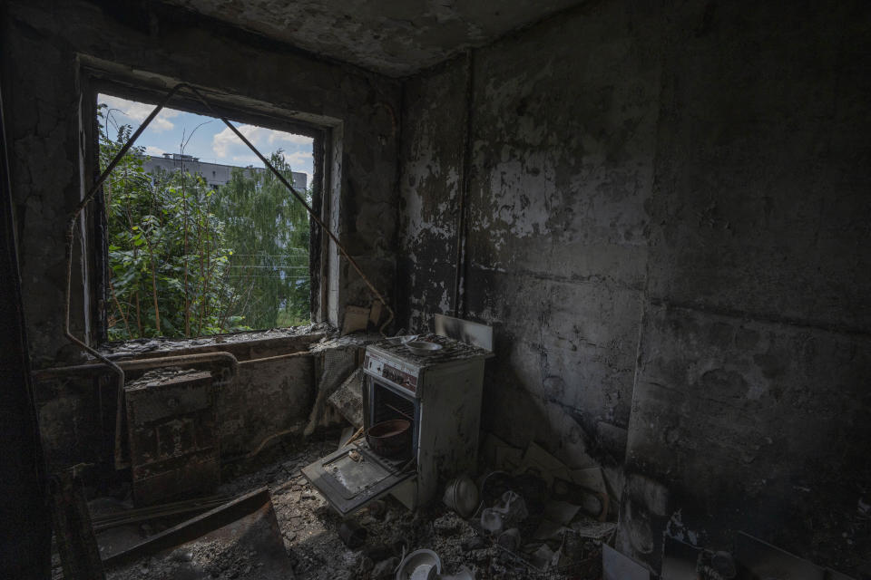 Damage in the kitchen of 64-year-old Tetiana Solohub, destroyed from Russian aerial bombs, in Borodyanka, Kyiv region, Ukraine, Tuesday, June 28, 2022. "And now, at 64, I am forced to be homeless," Solohub said. She doesn't have a damaged apartment to live in. Hers is completely gone. Solohub now lives in a camp made of shipping containers. (AP Photo/Nariman El-Mofty)