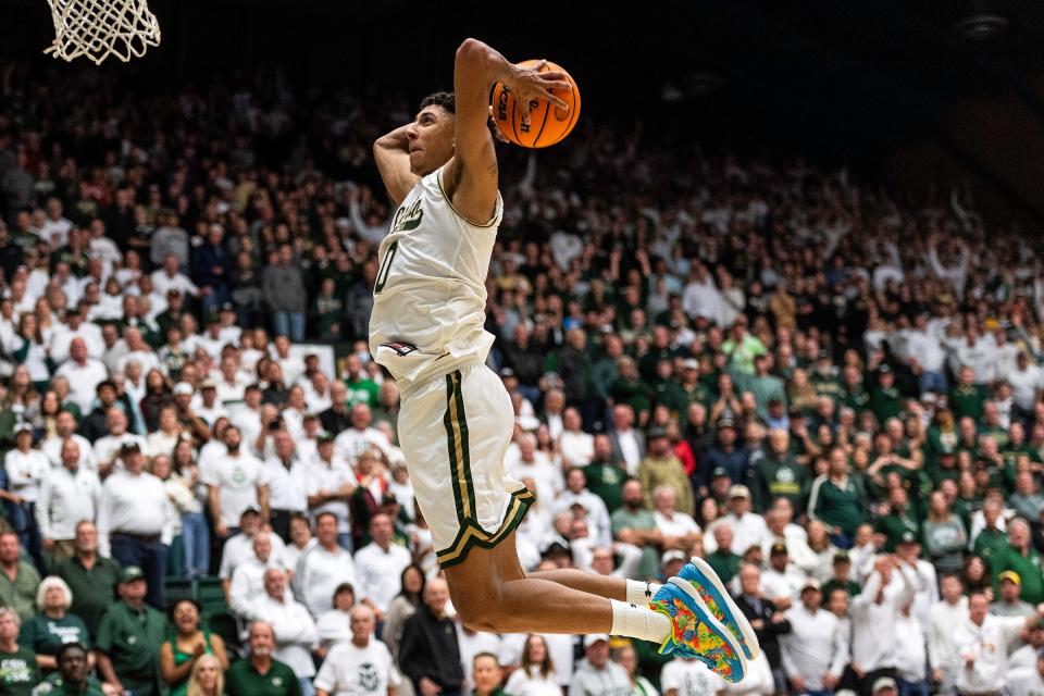 Colorado State University's Nique Clifford (10) breaks away for a slam dunk during a game against CU at Moby Arena in Fort Collins on Nov. 29, 2023.