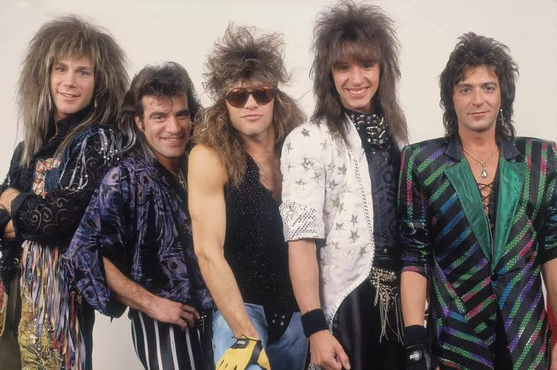 Portrait of American rock band Bon Jovi backstage before a performance, Illinois, early March, 1987. Pictured are, from left, David Bryan, Tico Torres, Jon Bon Jovi, Richie Sambora, and Alec John Such.