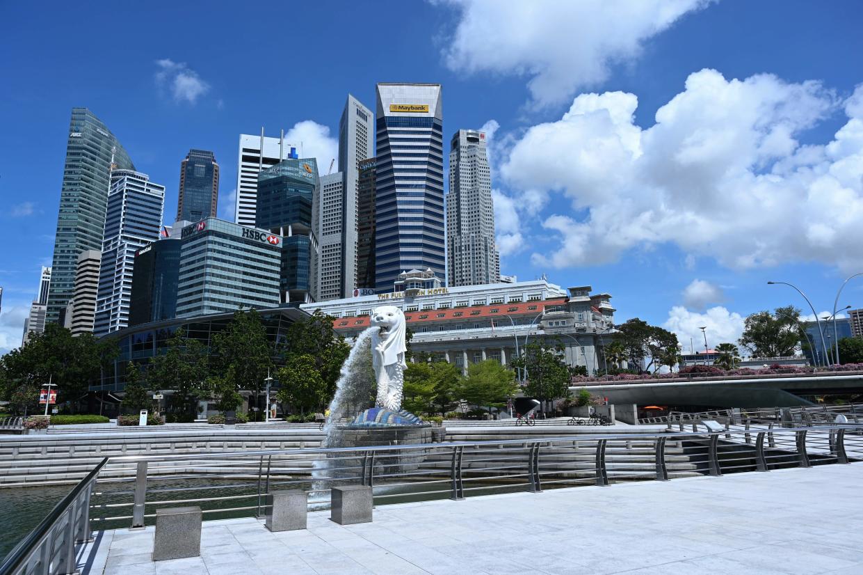 A general view shows the Singapore skyline behind the Merlion park on May 15, 2020. (Photo by Roslan RAHMAN / AFP) (Photo by ROSLAN RAHMAN/AFP via Getty Images)