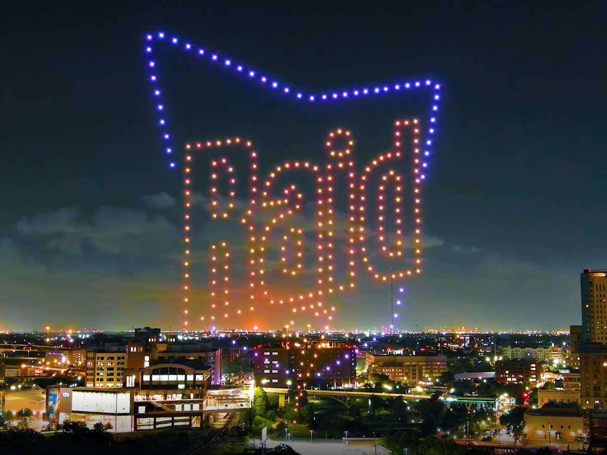 Drones equipped with LEDs are increasingly projecting adverts on the night sky over the US (Pixis drones)