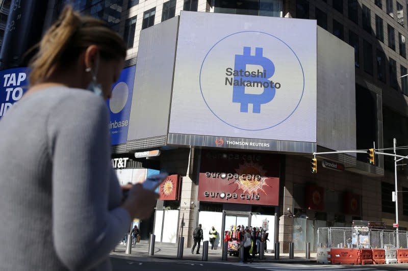 The Bitcoin logo is displayed on a screen in Times Square when Coinbase Global Inc. began trading under the symbol COIN at the Nasdaq Opening Bell in New York City in April 2021. File Photo by John Angelillo/UPI