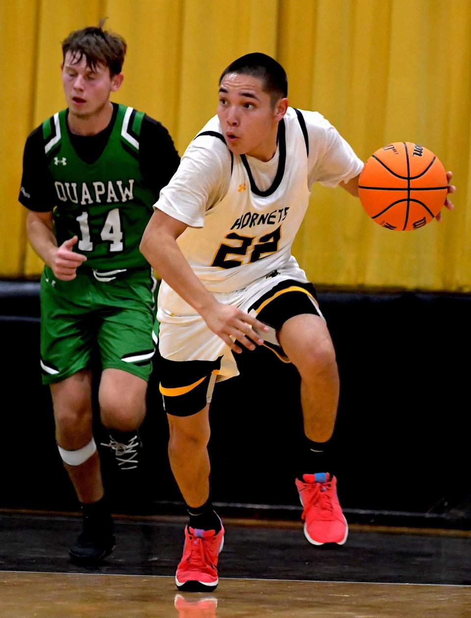 Copan High School's Karson Woodworth (22) drives the ball during earlier season basketball action. The Copan boys defeated Barnsdall in overtime 66-65, while the Barnsdall Lady Panthers girls beat the Lady Hornets 42-30 in Copan on Dec. 2, 2024.