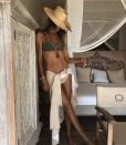 <p>Elle Macpherson, 54, shows off her abs in a hunter green bikini and low-slung sarong. (Photo: Instagram/Elle Macpherson) </p>
