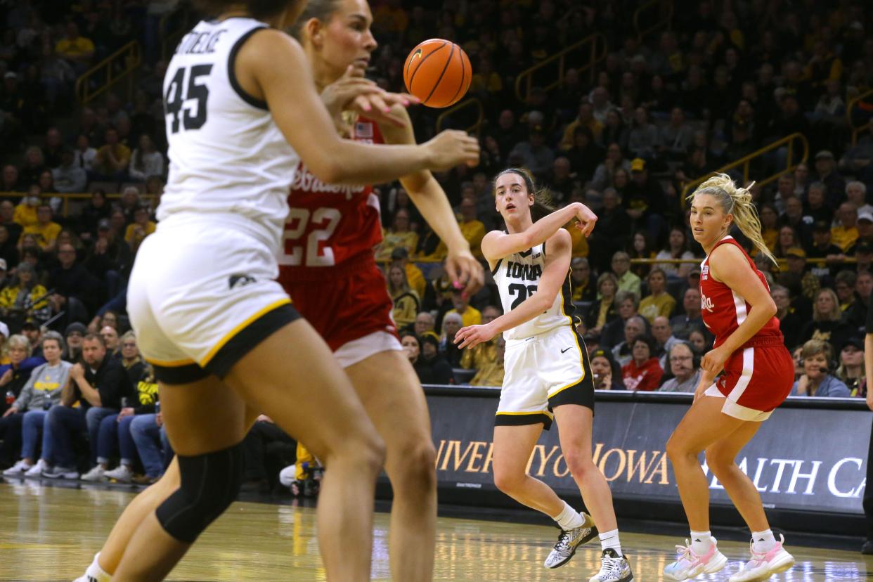 Iowa's Caitlin Clark leads the nation in scoring (32.1 points per game) and assists (7.7 per game) this season.