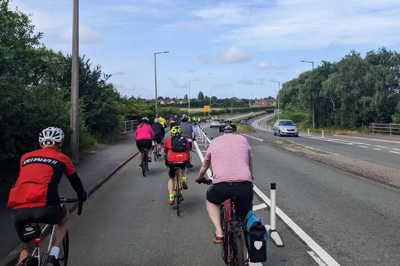 Cyclists using the controversial Fender Lane cycle route.