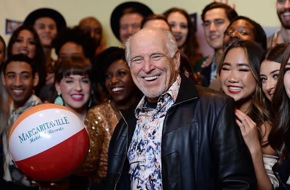 HOLLYWOOD, CALIFORNIA - FEBRUARY 18: Musician Jimmy Buffett (C) and cast members arrive at Jimmy Buffett's 