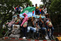 Indigenous demonstrators attend an anti-government march in Cali, Colombia, Wednesday, May 12, 2021. Colombians have taken to the streets for weeks across the country after the government proposed tax increases on public services, fuel, wages and pensions, but have continued even after President Ivan Duque walked back the tax hike. (AP Photo/Andres Gonzalez)