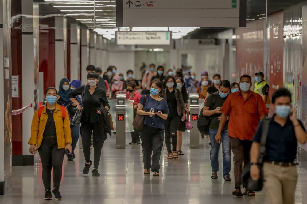 Commuters throng the Maluri MRT station on first day of the conditional movement control order in Kuala Lumpur May 4, 2020. — Picture by Firdaus Latif