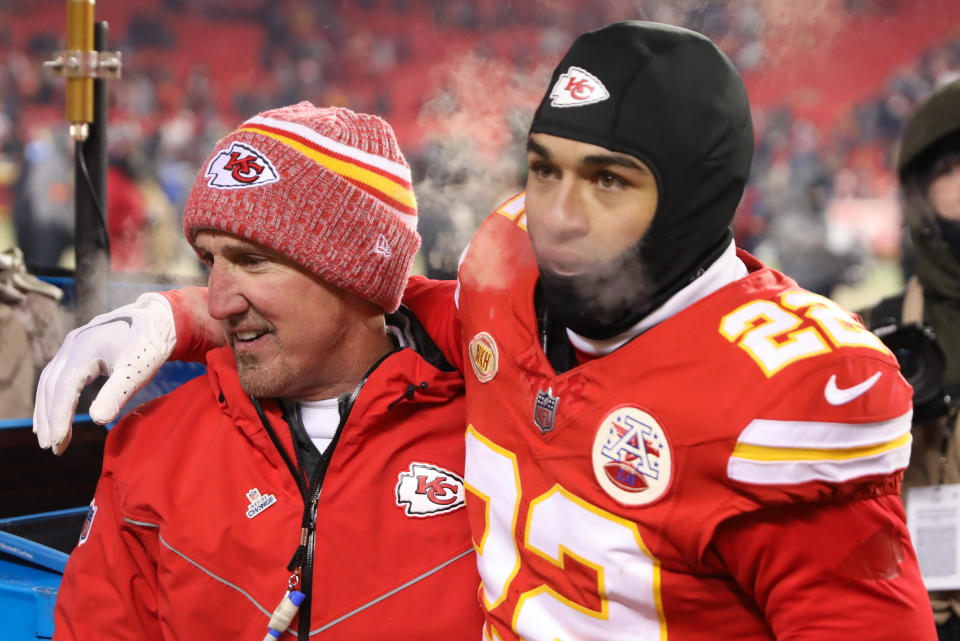 KANSAS CITY, MO - JANUARY 13: Kansas City Chiefs cornerback Trent McDuffie (22) hugs defensive coordinator Steve Spagnuolo after an AFC Wild Card playoff game between the Miami Dolphins and Kansas City Chiefs on Jan 13, 2024 at GEHA Field at Arrowhead Stadium in Kansas City, MO. (Photo by Scott Winters/Icon Sportswire via Getty Images)