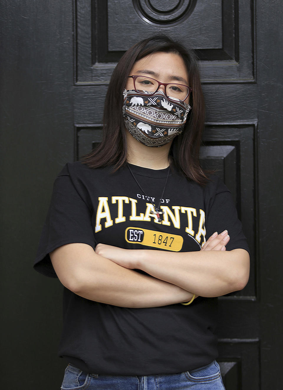 Claire Xu, poses for a photo, Friday, April 9, 2021, in Decatur, Ga., Xu was propelled into action following the mass fatal shootings of eight people, six of them Asian women, at a Georgia massage businesses in March. She organized a massive rally condemning violence against Asian Americans that drew support from a broad group of activists, elected officials and community members. But her own parents were opposed. (AP Photo/Akili-Casundria Ramsess)