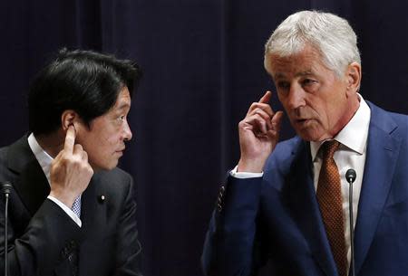 U.S. Secretary of Defense Chuck Hagel (R) and his Japanese counterpart Itsunori Onodera attend their joint news conference at the Defense Ministry in Tokyo April 6, 2014. The United States will deploy two additional destroyers equipped with missile defense systems to Japan by 2017, in a move Hagel said on Sunday was a response in part to North Korean missile launches that have alarmed the region. REUTERS/Issei Kato