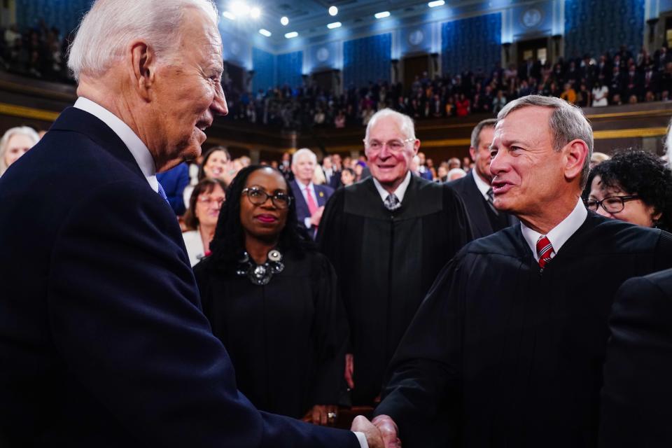 Mar 7, 2024; Washington, DC, USA; US President Joe Biden (L) greets Chief Justice of the Supreme Court John Roberts (R) as he arrives to the House Chamber of the US Capitol for his third State of the Union address to a joint session of Congress at the U.S. Capitol in Washington on March 7, 2024. Mandatory Credit: Shawn Thew/Pool via USA TODAY ORG XMIT: USAT-746164 ORIG FILE ID: 20240307_so6_nbr_151.JPG