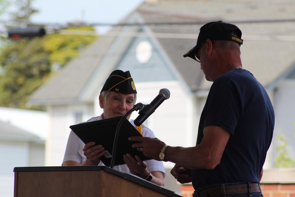 Cheboygan County Veterans Subcommittee member Pat Bolen surprised Diane Mills with her Hometown Hero award during the county's Memorial Day ceremonies at Festival Square, thanking her for all of her service to the country, as well as Cheboygan. 