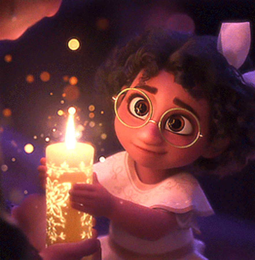 Young Maribel holding the lit candle in "Encanto"