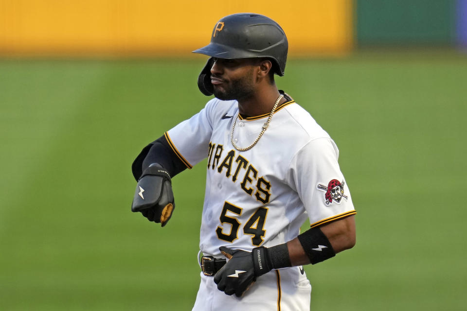 Pittsburgh Pirates' Joshua Palacios celebrates as he stands at first after an RBI single off Washington Nationals starting pitcher Jackson Rutledge during the first inning of a baseball game in Pittsburgh, Wednesday, Sept. 13, 2023. (AP Photo/Gene J. Puskar)