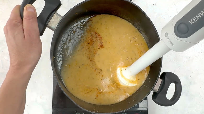 liquidizing soup with handheld blender