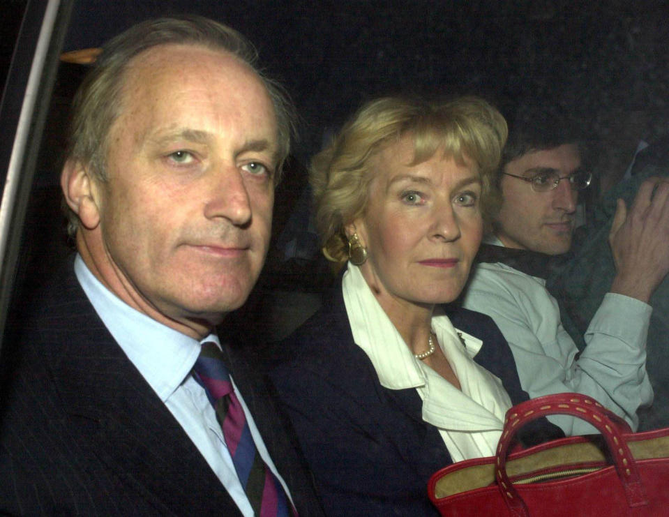 Neil Hamilton and wife Christine and Louis Theroux leaving Barkingside police station