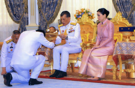 King Maha Vajiralongkorn and his consort, General Suthida Vajiralongkorn named Queen Suthida attend their wedding ceremony in Bangkok, Thailand May 1, 2019. Thailand Royal Household via REUTERS