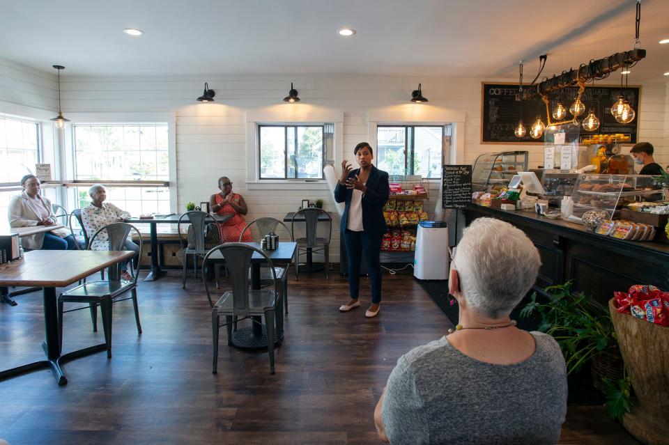 Attorney general candidate Andrea Campbell talks to people gathered at a campaign event at the Franklin St. Cafe on Franklin Street in Framingham, Aug. 12, 2022.