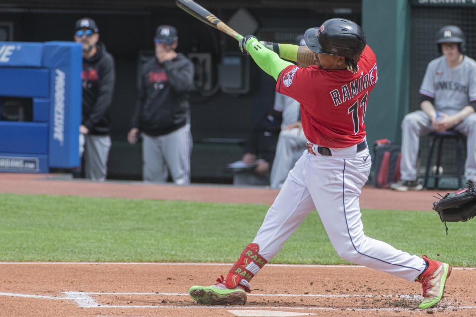 Cleveland Guardians' Jose Ramirez hits an RBI-single off Minnesota Twins starting pitcher Joe Ryan during the first inning of a baseball game in Cleveland, Sunday, May 7, 2023. (AP Photo/Phil Long)