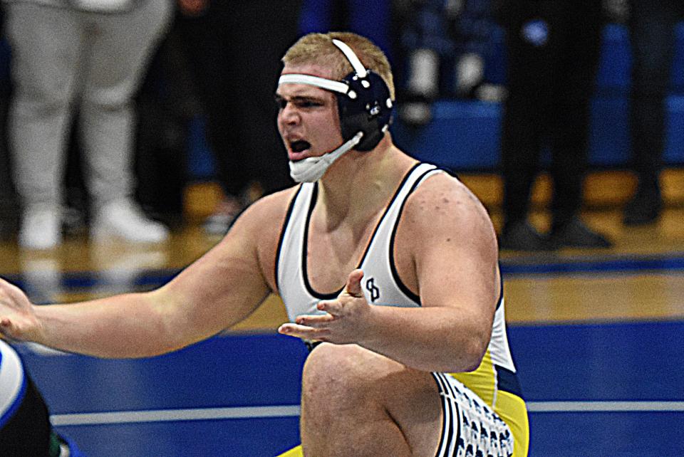 Hartland heavyweight Vincent Cox reacts after it was initially ruled he didn't complete a pin before the clock expired in the first period against Detroit Catholic Central. He was ultimately awarded the pin.