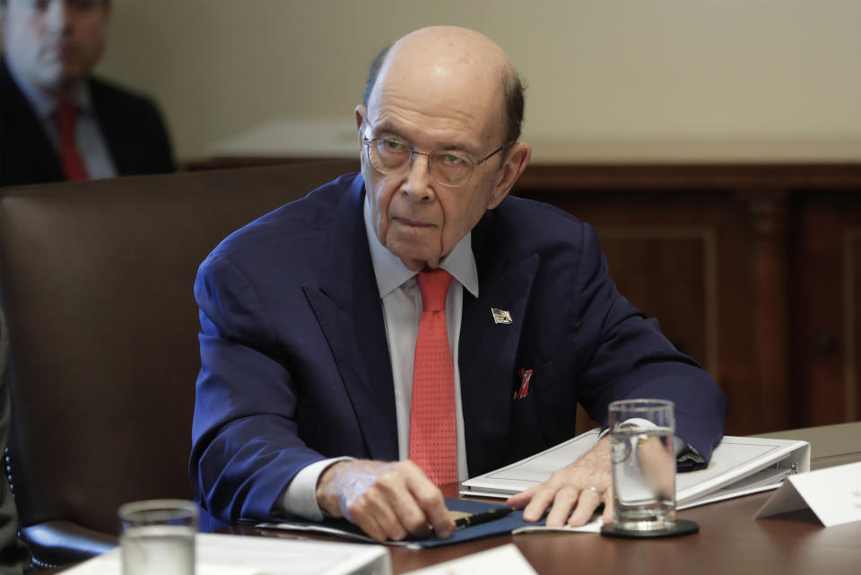 FILE - In this Oct. 21, 2019, file photo, Commerce Secretary Wilbur Ross listening to President Donald Trump speak during a Cabinet meeting in the Cabinet Room of the White House in Washington. The White House has announced that a national security adviser Robert C. O'Brien and Commerce Secretary Ross will attend two summits in Thailand. (AP Photo/Pablo Martinez Monsivais)