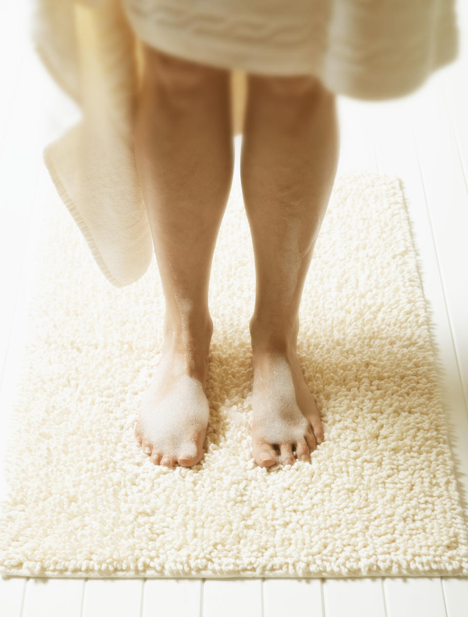 The floor is one of the most germ-ridden places in the bathroom so a dirty bathmat is inevitable. To banish bacteria and stop your damp mats from going mouldy, it’s important to regularly wash them.   • Put the bath mat into a washing machine and wash on a high heat to get rid of as many germs as possible.  • Now the washing machine is on, it’s time to tackle that bathroom floor. Pour hot water into your mop bucket and add a cup of floor cleaner.  • Mop the floor, making sure to wipe the skirting boards as you go and leave the floor to dry.  • When the floor and bathmat are dry, place the mat back in its original place.  