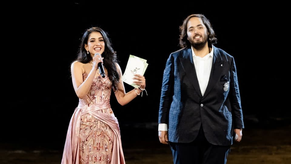 Anant Ambani and Radhika Merchant address guests during their pre-wedding celebrations. - Reliance Industries/Handout/Reuters