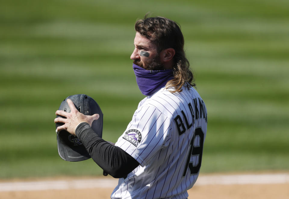 Colorado Rockies' Charlie Blackmon waits to bat against Texas Rangers relief pitcher Jimmy Herget in the eighth inning of a baseball game Sunday, Aug. 16, 2020, in Denver.  (AP Photo/David Zalubowski)