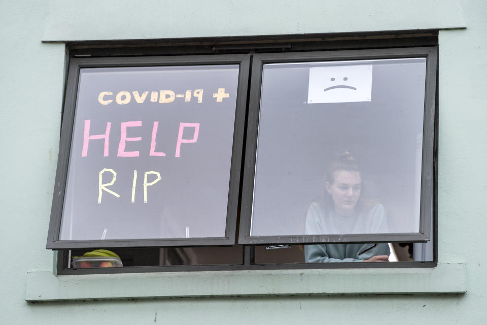 CARDIFF, WALES - OCTOBER 12: A student self isolating at Talybont South halls of residence at Cardiff University looks from her window on October 12, 2020 in Cardiff, Wales. Students at the Cardiff University Talybont South halls were tested over the weekend for coronavirus as part of precautionary measures to prevent the spread of the virus. Seventy-five students and staff across the university have tested positive. (Photo by Matthew Horwood/Getty Images)