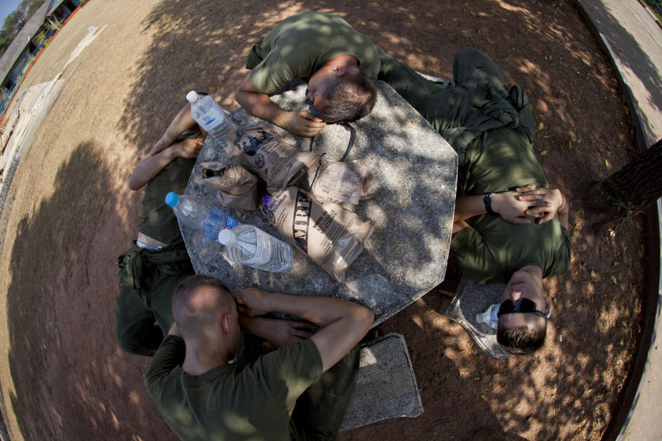 U.S. Marines with Marine Wing Support Squadron 172, Marine Aircraft Group 36 sleep during a lunch break while constructing a classroom during Exercise Cobra Gold 2013 (CG 13) at Ban Nam Chiao Elementary School in Lam Ngob District, Trat Province, Kingdom of Thailand, Jan. 21, 2013.&nbsp;