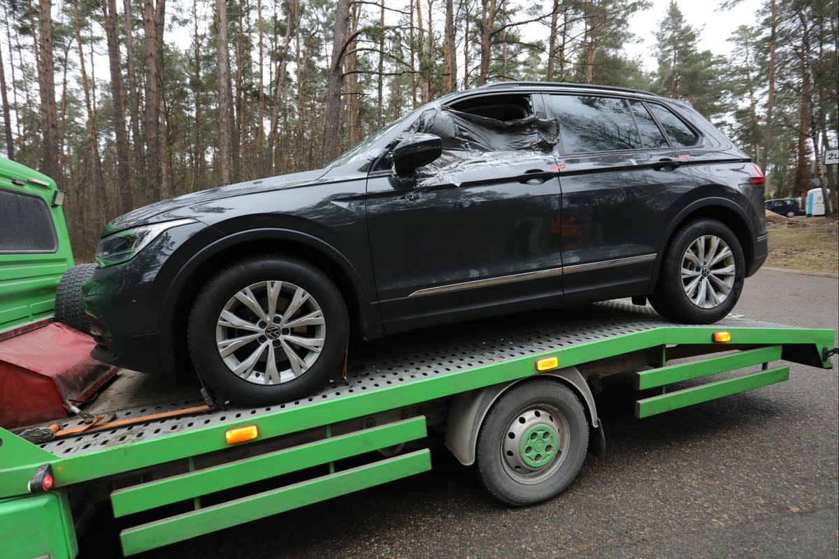 Volkov’s car is taken away after the attack outside his home earlier this year (AFP/Getty)