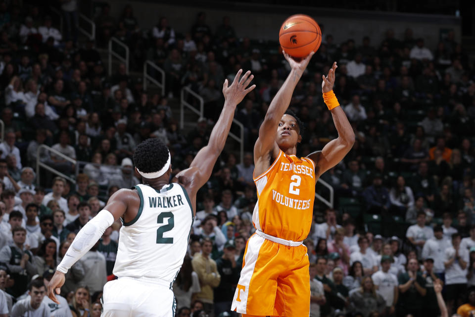 Tennessee's Jordan Gainey, right, shoots against Michigan State's Tyson Walker, left, during the first half of an NCAA college basketball exhibition game, Sunday, Oct. 29, 2023, in East Lansing, Mich. (AP Photo/Al Goldis)