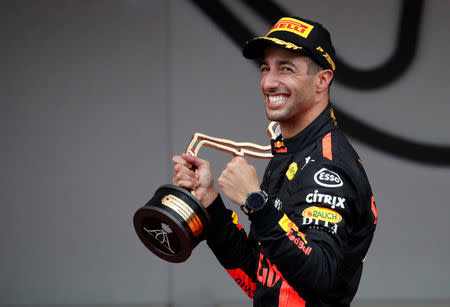 Formula One F1 - Monaco Grand Prix - Circuit de Monaco, Monte Carlo, Monaco - May 27, 2018 Red Bull’s Daniel Ricciardo celebrates winning the race with the trophy REUTERS/Benoit Tessier