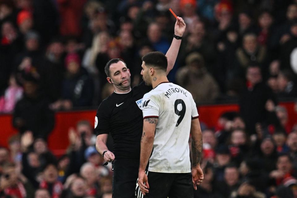 Aleksandar Mitrovic confronts referee Chris Kavanagh during the FA Cup tie at Old Trafford (AFP via Getty Images)