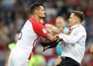 Soccer Football - World Cup - Final - France v Croatia - Luzhniki Stadium, Moscow, Russia - July 15, 2018 Croatia's Dejan Lovren clashes with a pitch invader REUTERS/Carl Recine