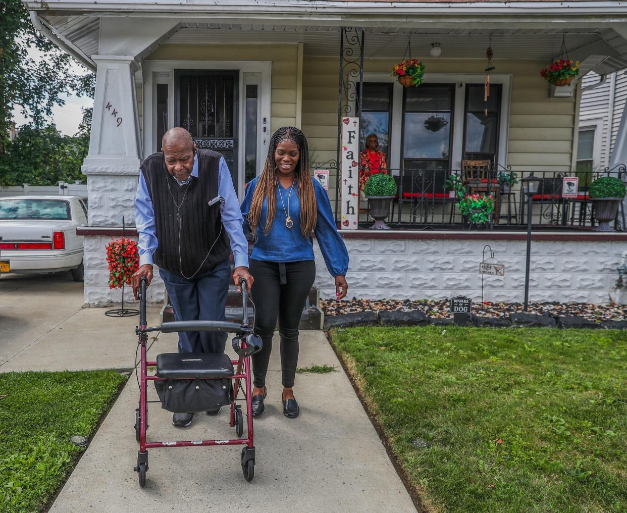 Myzette Howell spots her father Percy Howell as they take a walk around their neighborhood in Buffalo.