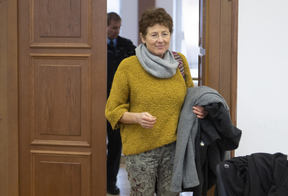 Gynaecologist Kristina Haenel enters the hearing room of the state court in Giessen, Germany, Thursday, Dec. 12, 2019. Gynaecologist Kristina Haenel has been convicted again of violating a ban on advertising abortions. (Boris Roessler/dpa via AP)