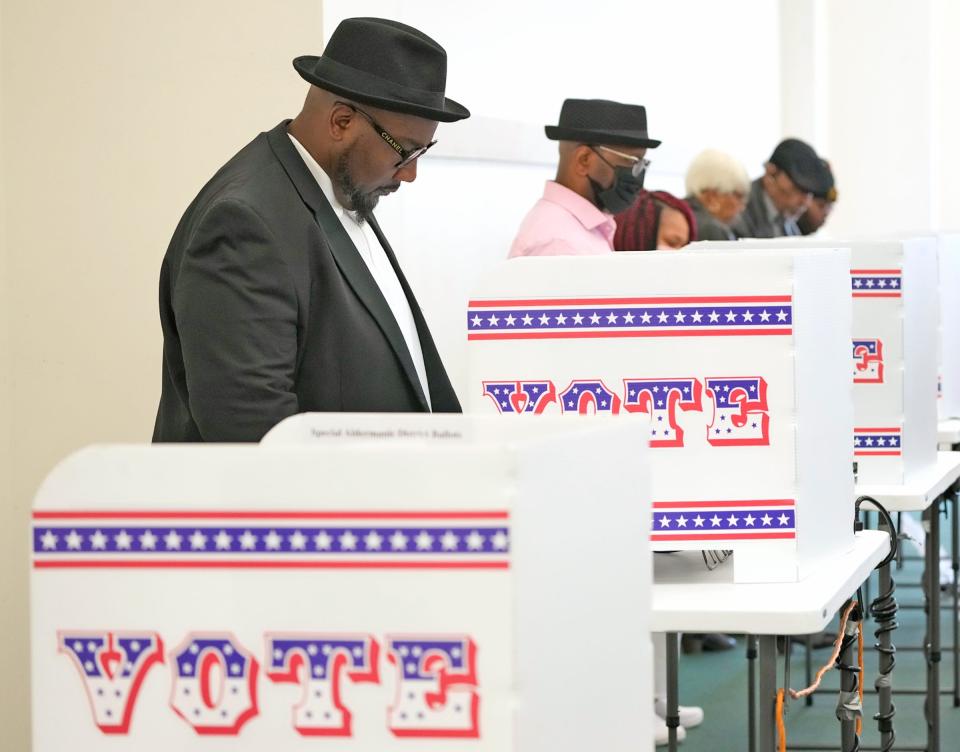 Charlie Maxwell, a member of the Mount Pilgrim Missionary Baptist Church, votes as part of the Souls to the Polls in Milwaukee on Oct. 30, 2022. Souls to the Polls Sunday is a historically energized day across the nation for congregations of Black churches to vote early together.