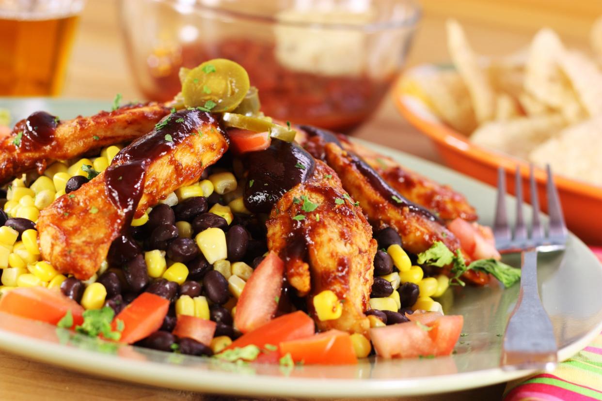 Southwestern style BBQ chicken strips with black bean and corn salad