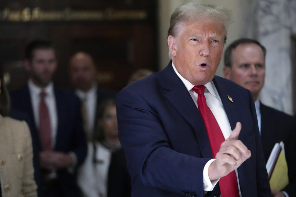 Former President Donald Trump speaks to reporters as he leaves the courtroom during a lunch break in his civil business fraud trial, Oct. 4, 2023, in New York. Trump's lawyers have asked a judge to postpone his Florida classified documents trial until after next year’s presidential election. The lawyers say they have not received all the records they need to prepare Trump's defense. (AP Photo/Mary Altaffer, File)