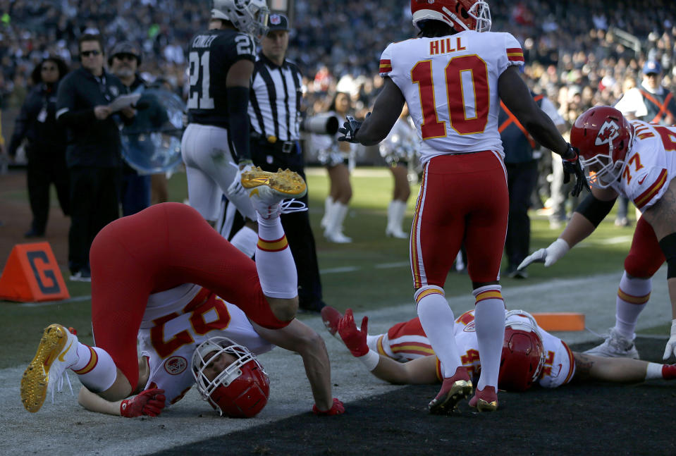 Kansas City Chiefs tight end Travis Kelce (87) celebrates with teammates after scoring against the Oakland Raiders during the first half of an NFL football game in Oakland, Calif., Sunday, Dec. 2, 2018. (AP Photo/D. Ross Cameron)