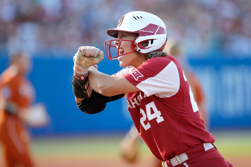 Oklahoma's Jayda Coleman (24) celebrates after a single in the first inning of the second game of the championship series in the Women's College World Series between the University of Oklahomaers (OU) and the Texas Longhorns at USA Softball Hall of Fame Stadium in Oklahoma City, Thursday, June 9, 2022. 