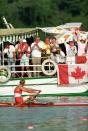 Silken Laumann rows past Canadian fans after the Olympic women's single scull competition in Banyoles, Spain on Aug. 2, 1992. Laumann won bronze. The Canadian Press/Ron Poling