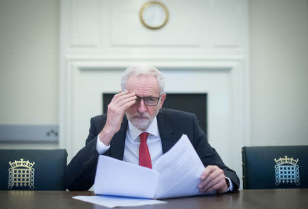 FILE PHOTO: British opposition Labour Party leader Jeremy Corbyn holds the Political Declaration, setting out the framework for the future UK-EU relations, at his office in the Houses of Parliament in London, Britain April 2, 2019. Stefan Rousseau/Pool via REUTERS/File Photo