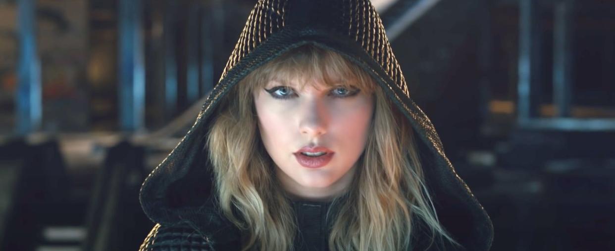 taylor wearing a cloak in her two videos