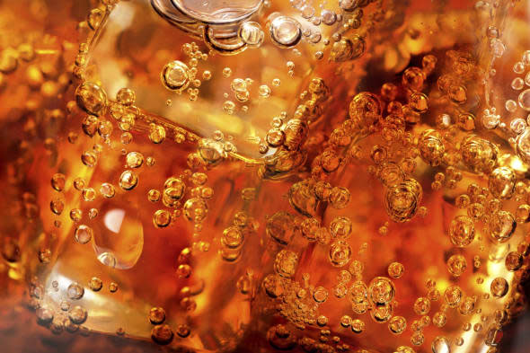 Background of cola with ice and bubbles