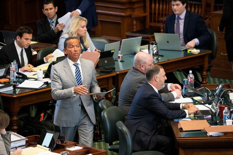 Ken Paxton's attorney Tony Buzbee looks at evidence while questioning a witness during Paxton's Senate impeachment trial Wednesday.