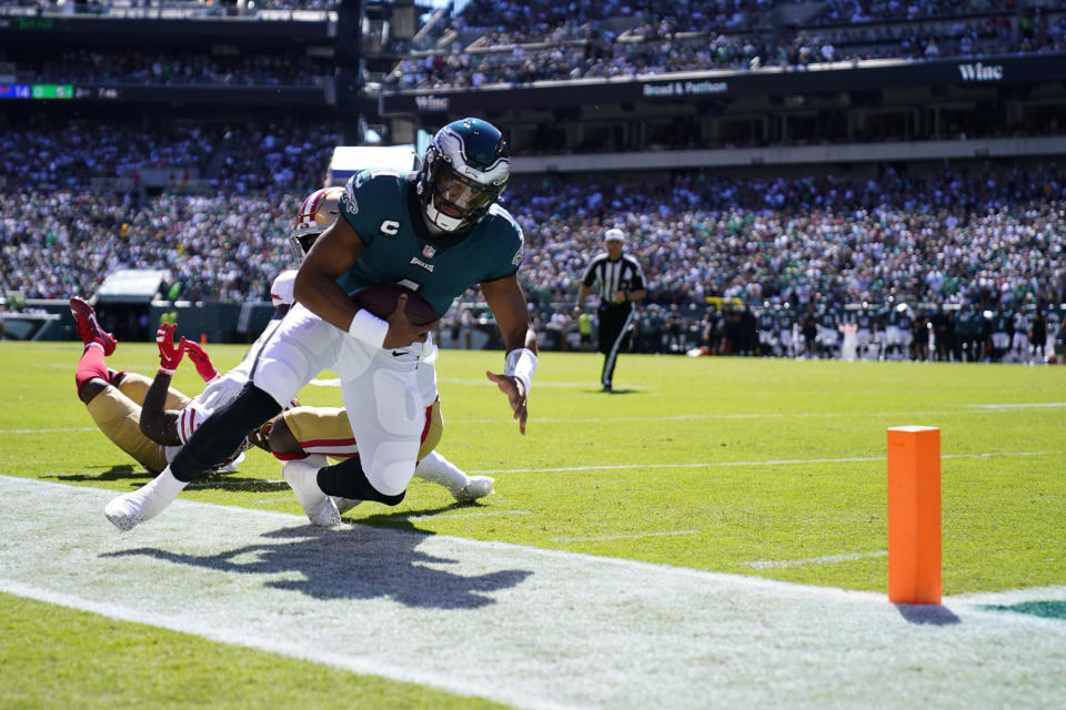 Philadelphia Eagles quarterback Jalen Hurts (1) is forced out of bounds during the first half of an NFL football game against the San Francisco 49ers on Sunday, Sept. 19, 2021, in Philadelphia. (AP Photo/Matt Rourke)